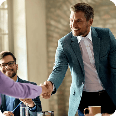 BNI logo over an image of two people shaking hands